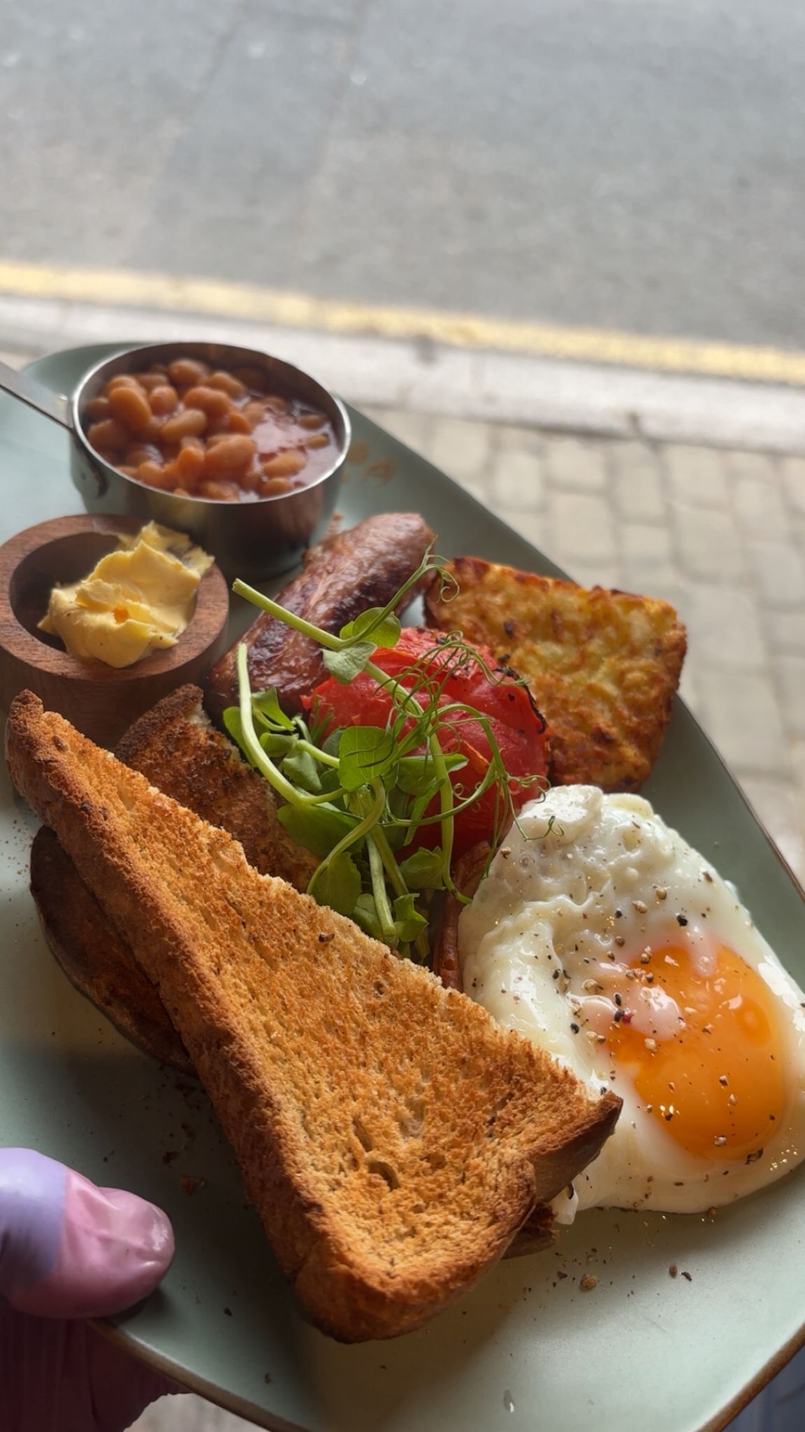 The Hideout breakfast with egg, sausage, beans and toast